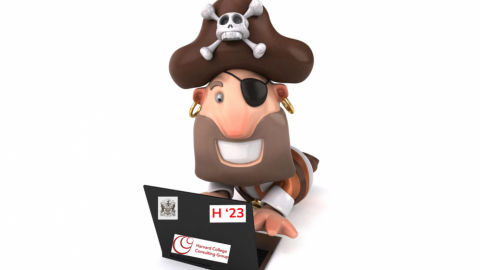 A cartoon pirate wearing an eyepatch, pirate hat, and earrings smiles eagerly at an open laptop. The laptop has three stickers on the back, an H '23, an HCCG logo, and the Porcellian Club logo.
