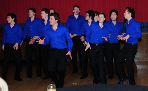 an a capella group peforms. 